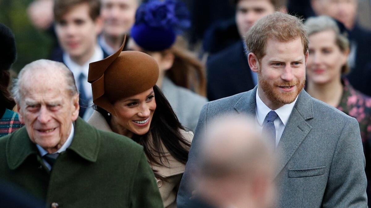 In this 2017 file photo Prince Philip, Prince Harry and Meghan Markle attend the Royal Family's traditional Christmas Day church service at St Mary Magdalene Church in Sandringham, Norfolk. Photo: AFP