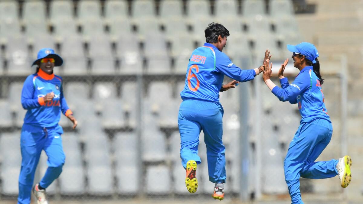 India's Deepti Sharma (centre), Smriti Mandhana (right) and Mithali Raj celebrate a wicket during a match against England on February 28, 2019. (AFP file)