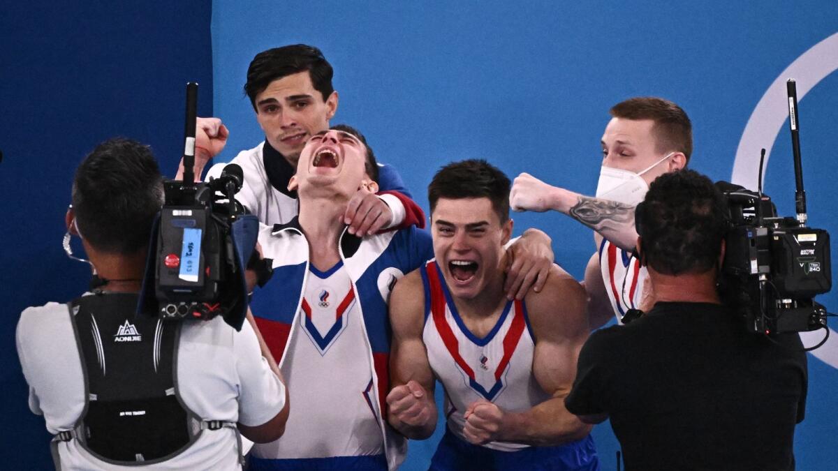 Russia's Denis Abliazin, David Belyavskiy, Artur Dalaloyan and Nikita Nagornyy celebrate after winning the artistic gymnastics men's team final. (AFP)