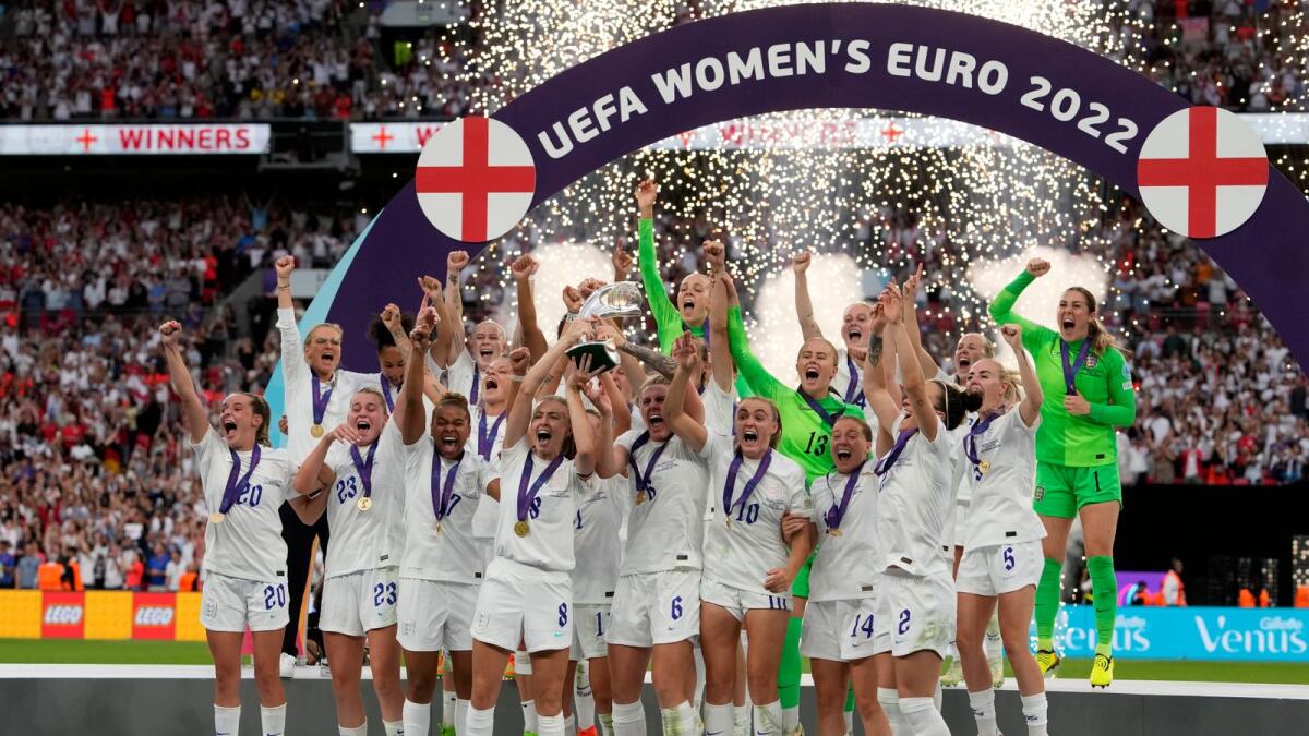 The England team celebrate with the trophy after winning the Women's Euro 2022 final against Germany at Wembley on Sunday. — AP
