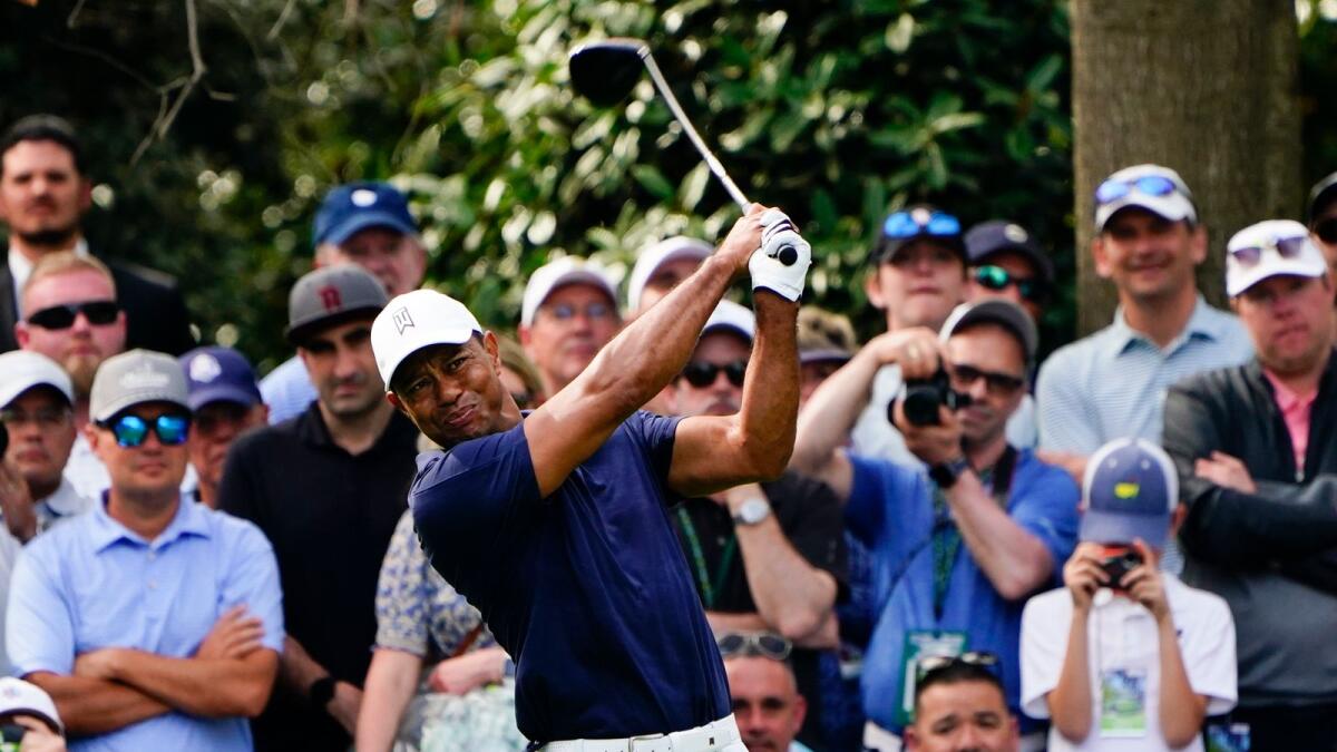 Tiger Woods tees off on the seventh hole during a practice round for the Masters golf tournament. (AP)