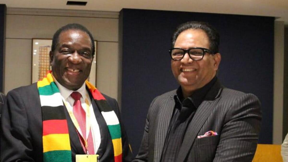 Shaji Ul Mulk, Chairman of Mulk Holdings and Abu Dhabi T10 (right) shakes hands with Zimbabwe President Emmerson Mnangagwa. — Supplied photo