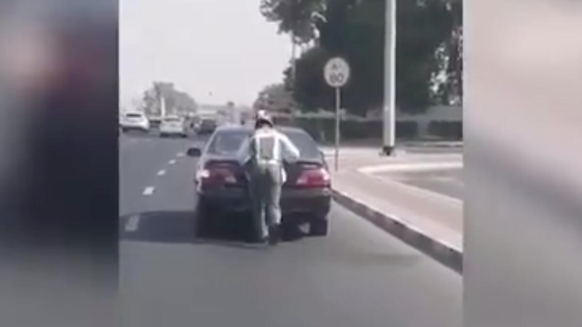 Video: Dubai cop pushes stalled car on busy road, gets promoted