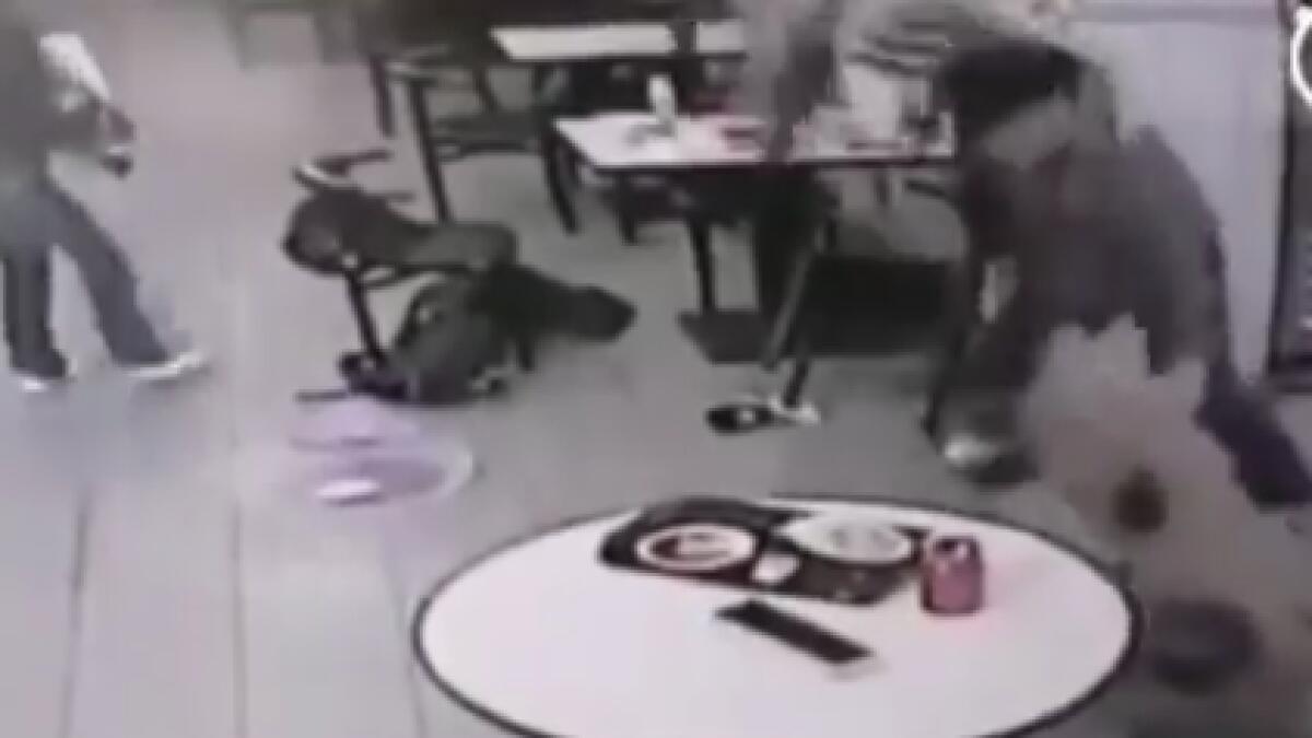 Video: Man beats customer with chair for complaining about noisy daughter