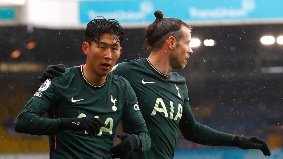 Tottenham's South Korean striker Son Heung-Min (left) celebrates scoring a goal with Gareth Bale during a Premier League match against Leeds United. (AFP)