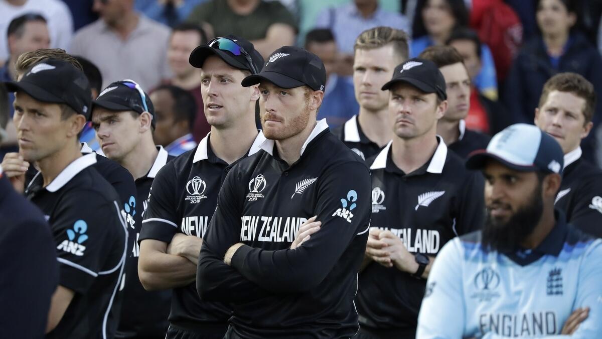 New Zealand's Martin Guptill, center, waits for the trophy presentation after losing the Cricket World Cup final match between England and New Zealand at Lord's cricket ground in London. AFP