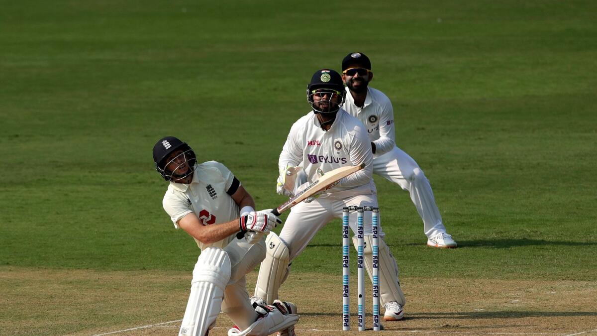 Joe Root hits a boundary during the first day of the first Test. (BCCI)