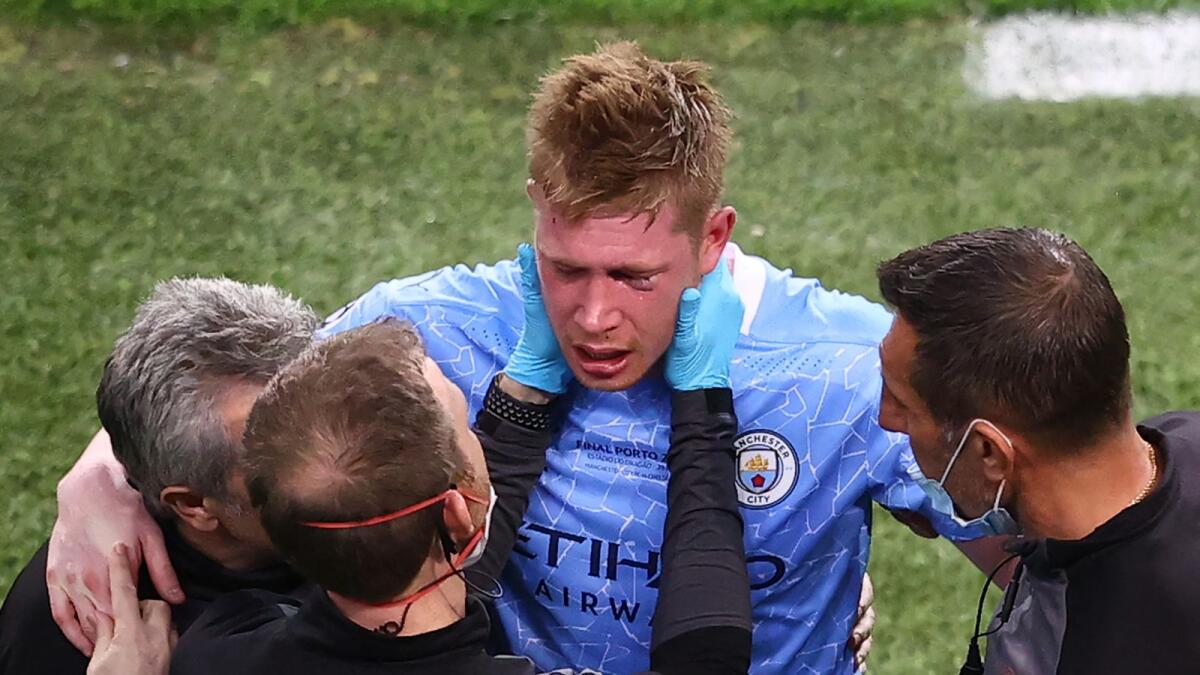Manchester City's Belgian midfielder Kevin De Bruyne (centre) receives treatment on the sidelines during the Uefa Champions League final against Chelsea. — AFP