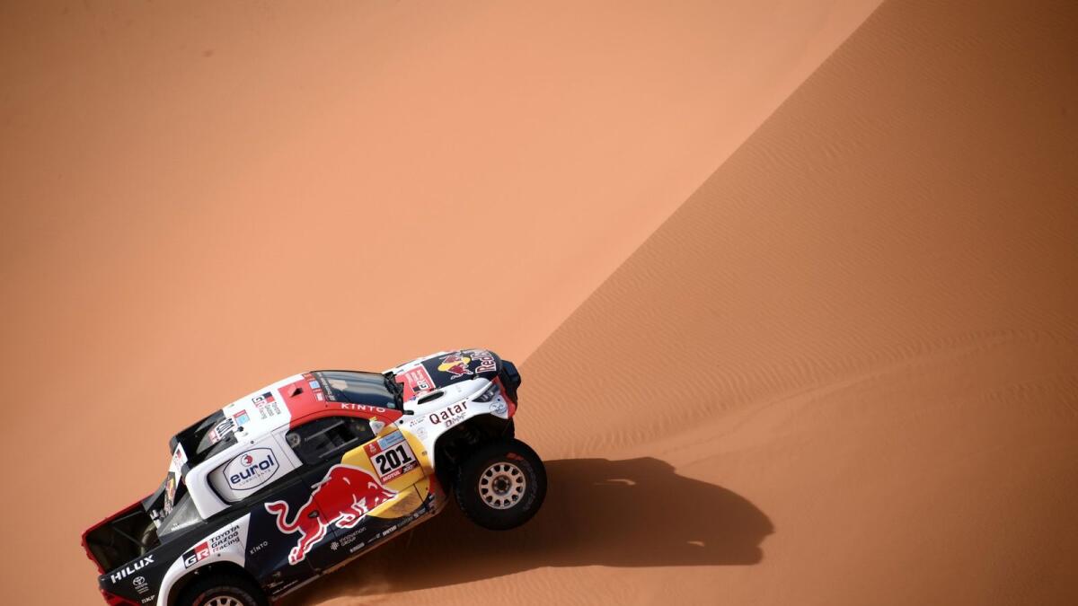 Nasser Al Attiyah and co-driver Mathieu Baumel compete during Stage 6 of the Dakar on Friday. — AFP