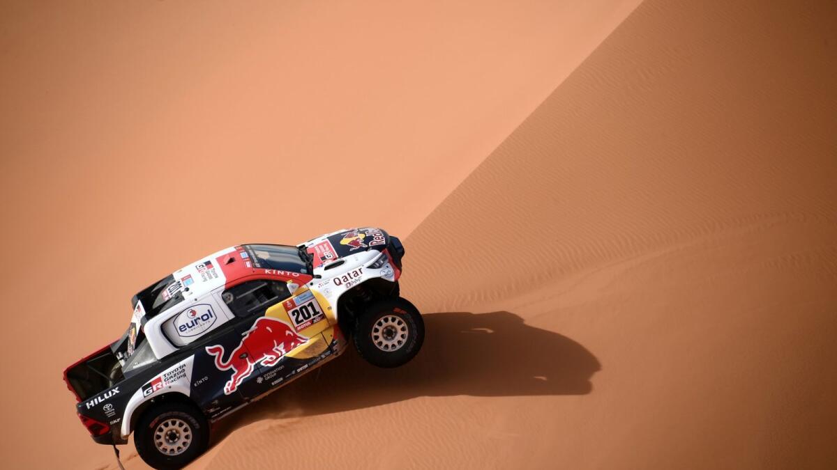 Nasser Al Attiyah and co-driver Mathieu Baumel compete during Stage 6 of the Dakar on Friday. — AFP