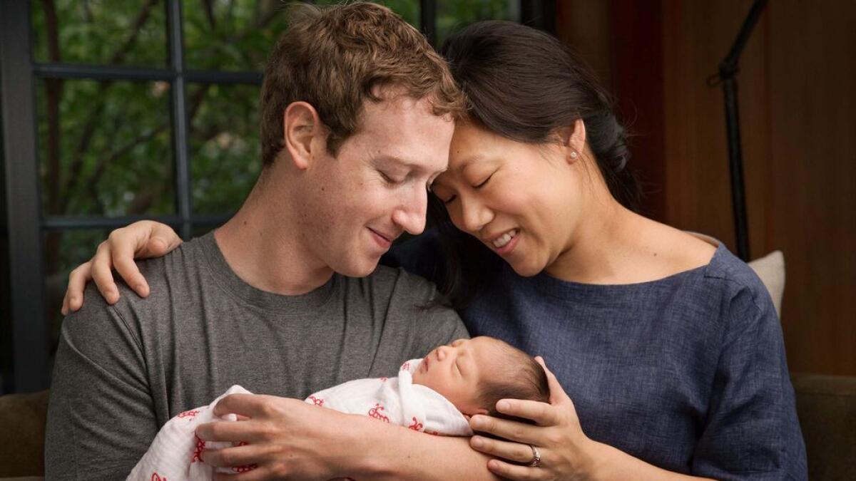 Facebook CEO, now a father, will give away 99% of his money