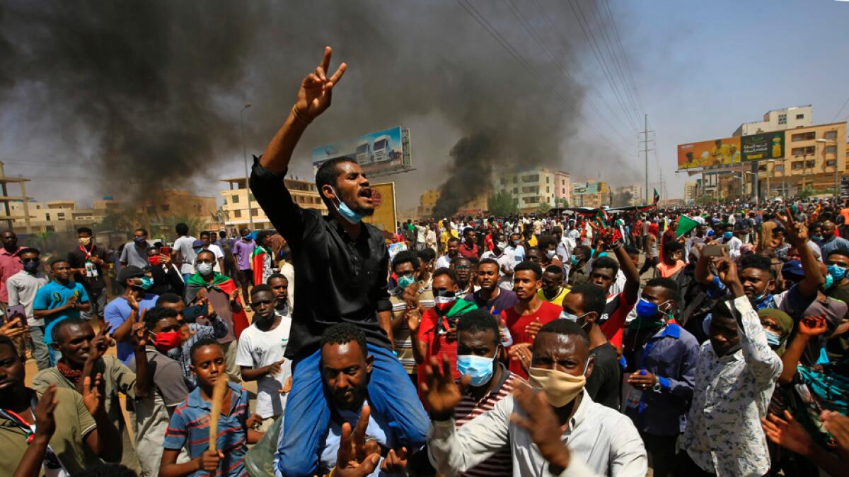 Sudanese demonstrators gesture as they chant during a protest on Sixty street in the east of the capital Khartoum. Photo: AFP