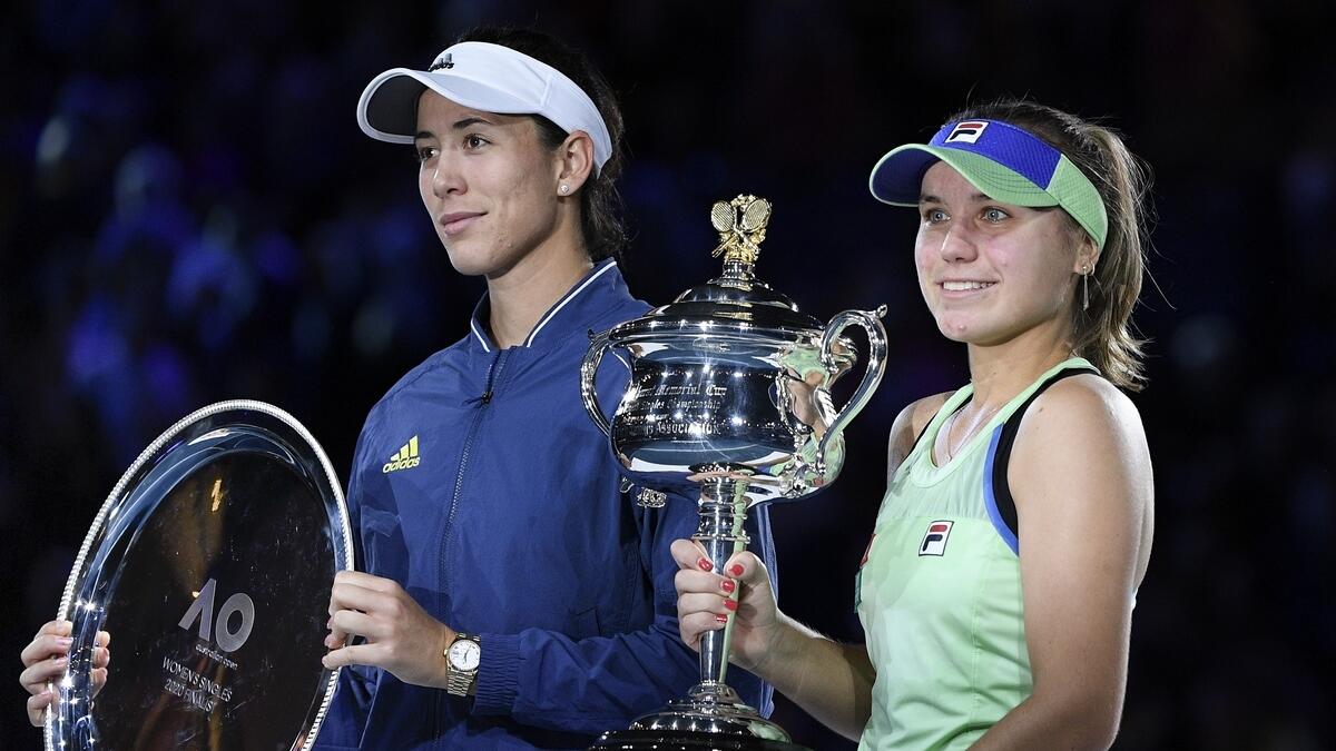 Sofia Kenin of the US holds the Daphne Akhurst Memorial Cup after defeating Spain's Garbine Muguruza in the women's singles final