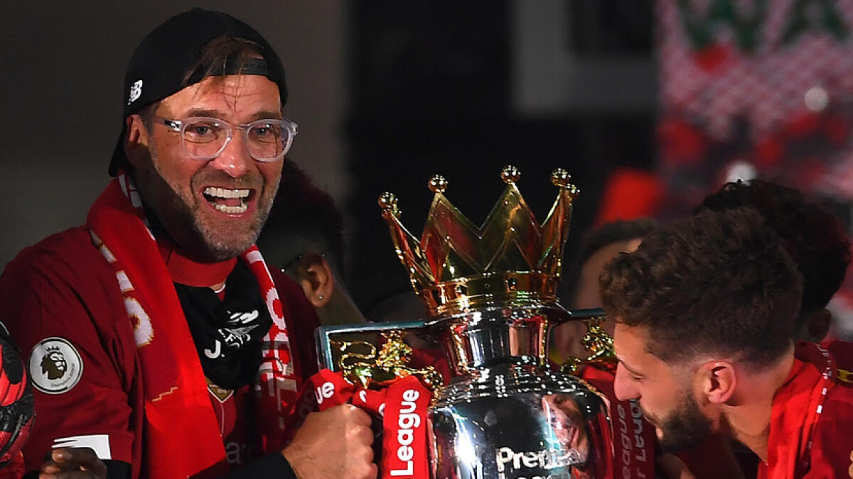 Jurgen Klopp (left) said winning the league was one of the best football moments in his life. -- AFP file