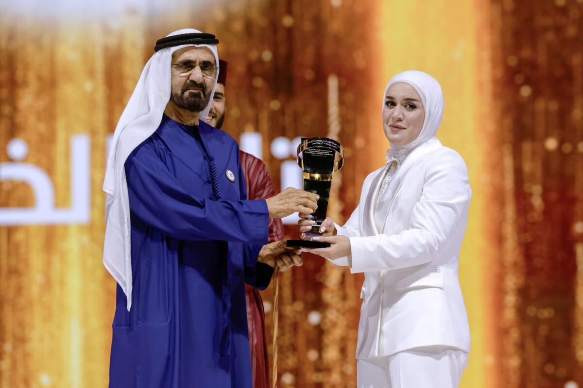 Sheikkh Mohammed presents the trophy to Tala Al Khalil. Photo: Dubai Media Office
