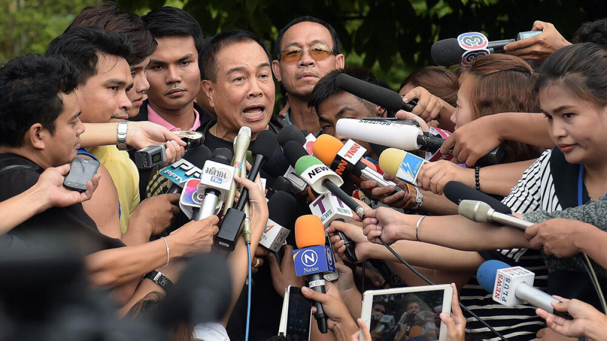 National police chief General Somyot Poompanmoung speaks to reporters outside the compound where police detained a suspect in the August 17 Bangkok shrine bombing.