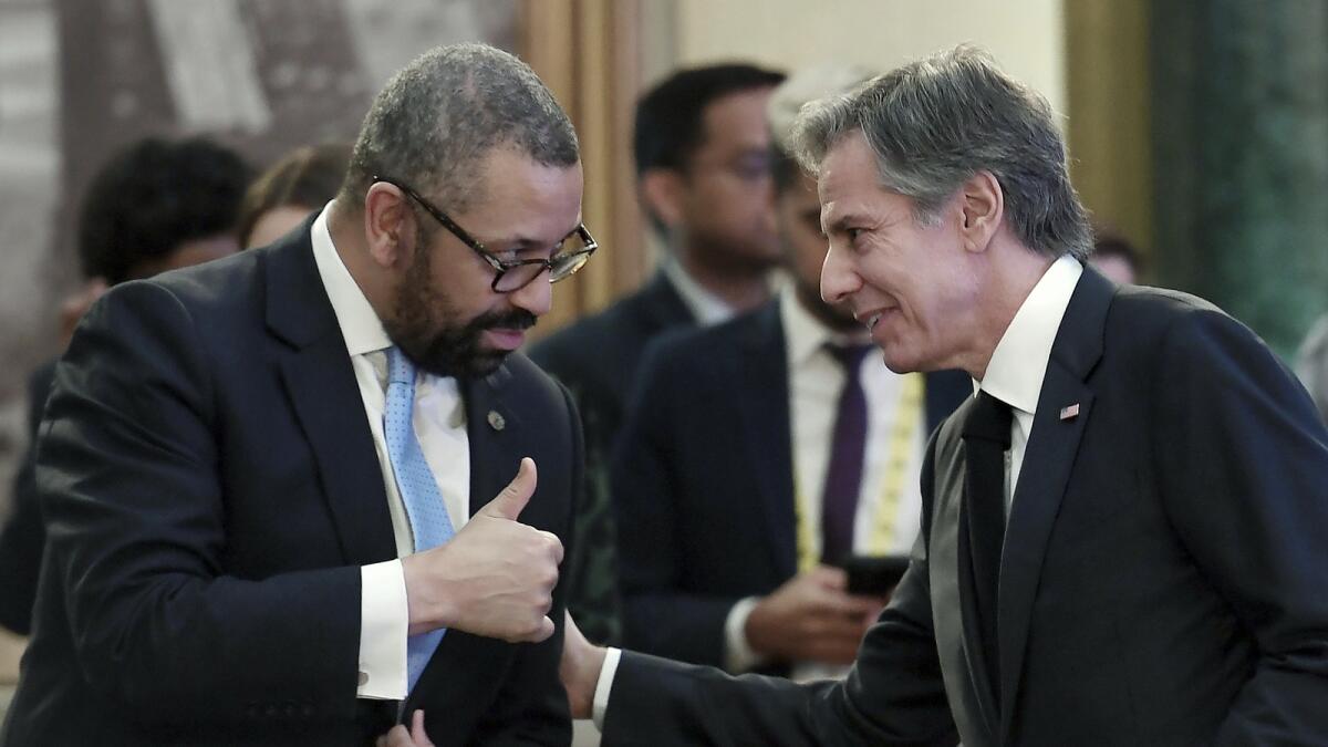 Bliken with UK foreign minister James Cleverly at the G20 meeting. - AP