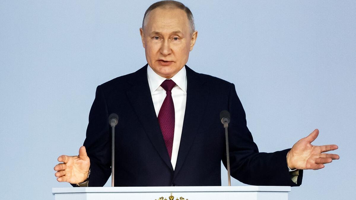 Russian President Vladimir Putin gestures as he gives his annual state of the nation address in Moscow. — AP