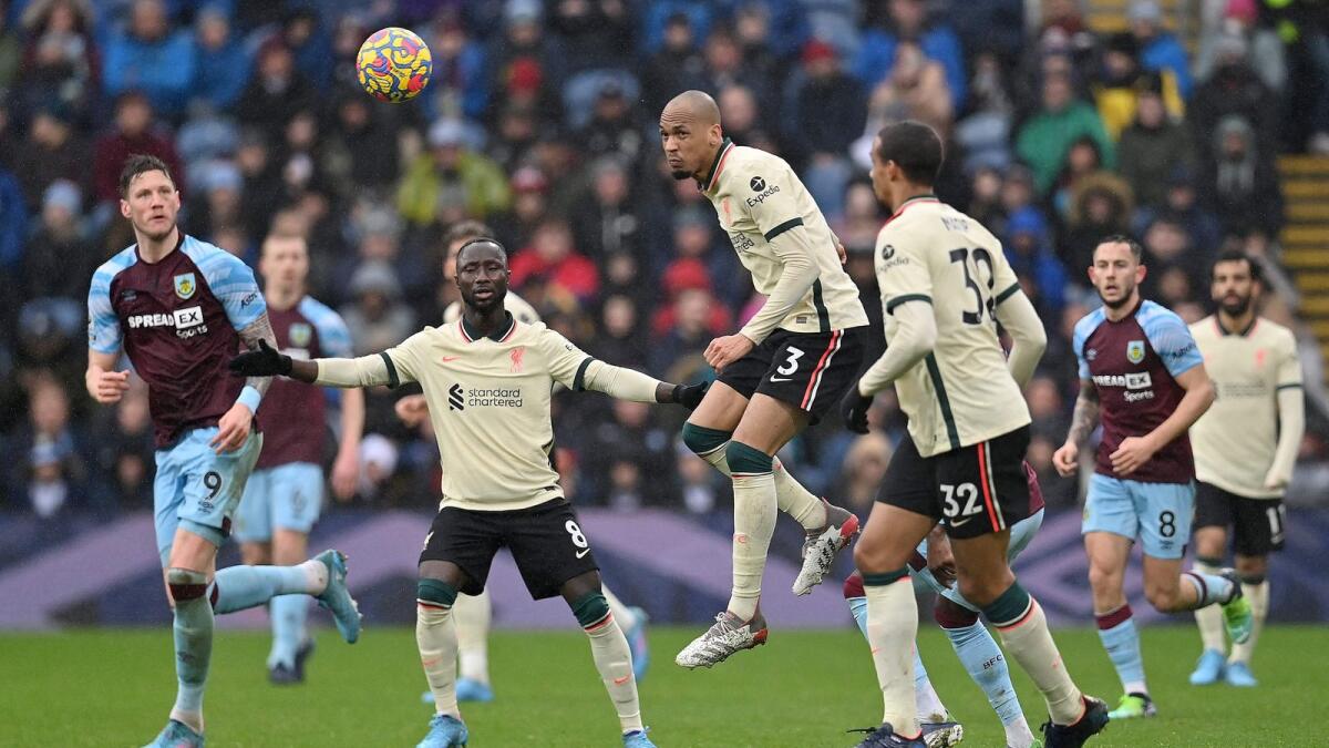 Liverpool midfielder Fabinho (centre) heads the ball during the Premier League match against Burnley. (AFP)