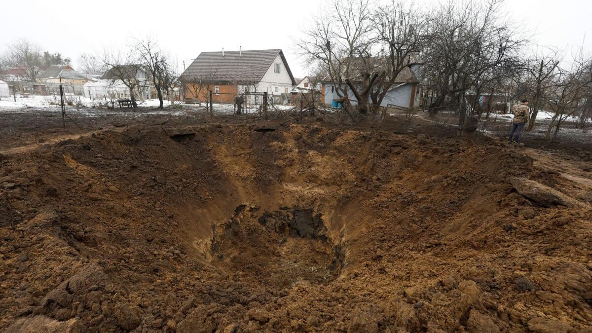 A view shows a crater left by a Russian missile in the village of Kopyliv, Kyiv region, Ukraine, on January 14. — Reuters