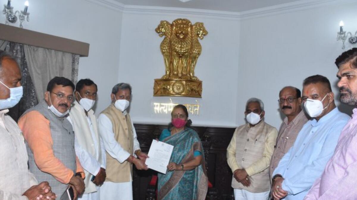 Uttarakhand Chief Minister Tirath Singh Rawat submitting his resignation letter to Uttarakhand Governor Baby Rani Maurya. Photo: ANI