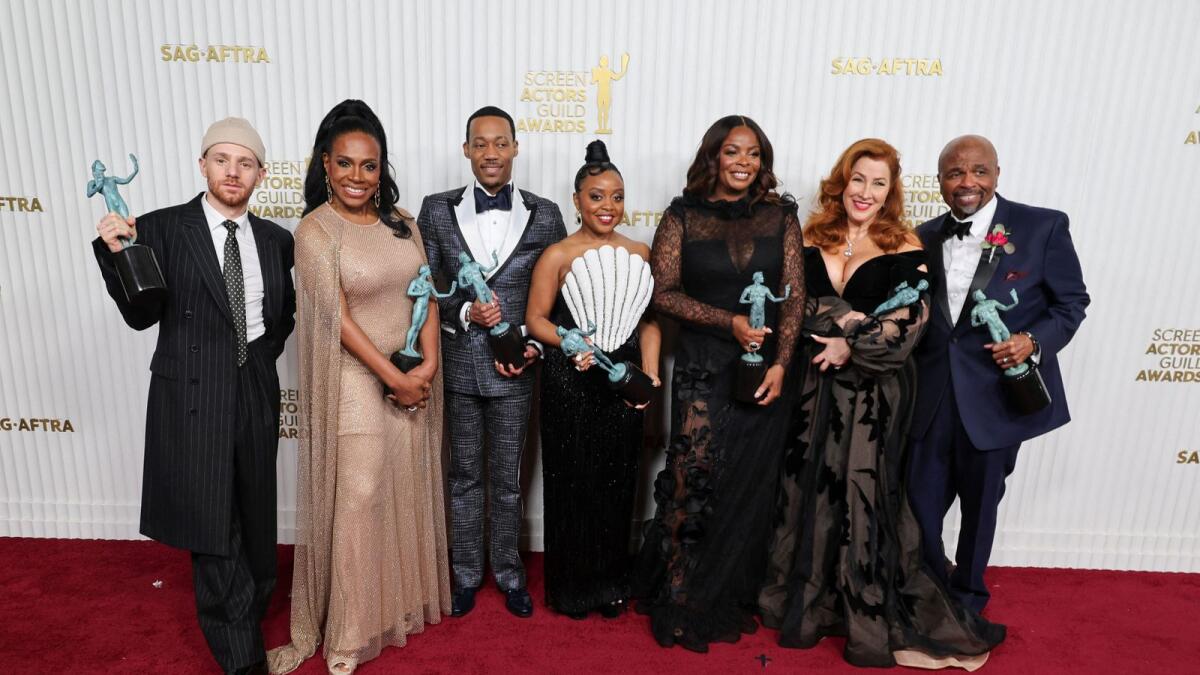 Chris Perfetti, Sheryl Lee Ralph, Tyler James Williams, Quinta Brunson, Janelle James, Lisa Ann Walter, and William Stanford Davis pose with the award for Outstanding Performance by an Ensemble in a Comedy Series for 'Abbott Elementary'