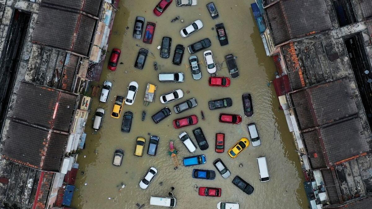 Aerial view shows vehicles and buildings inundated by floods in Shah Alam's Taman Sri Muda, one of the worst hit neighbourhoods in Selangor state, Malaysia.  –Reuters