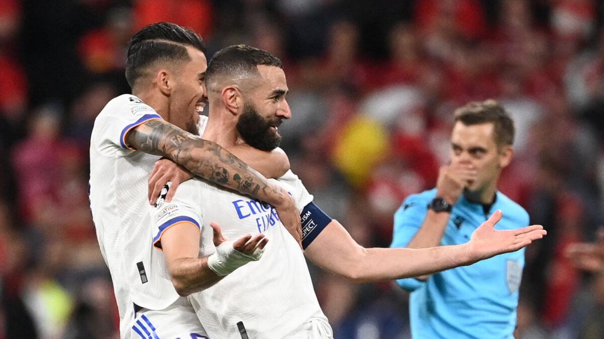 Real Madrid's Dani Ceballos (left) celebrates with Karim Benzema after the team's victory in the Champions League final against Liverpool. (AFP)