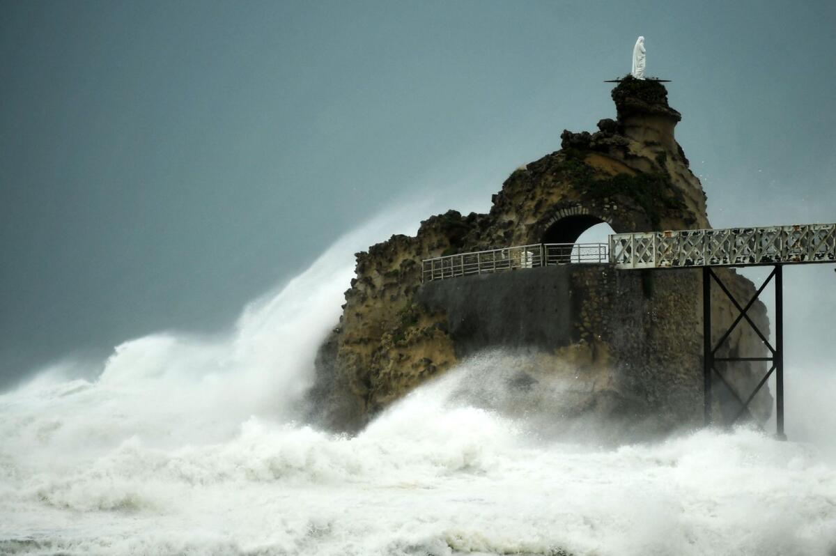 Waves crash on the 'Rocher de La Vierge' (Virgin Rock) as Storm Ciaran hits the region, in Biarritz, southwestern France. — AFP
