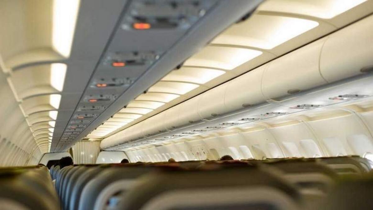 unruly passenger, dubai flight, harassment, air hostess