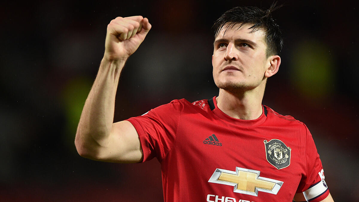 Harry Maguire aims to win trophies for Manchester United. -- AFP