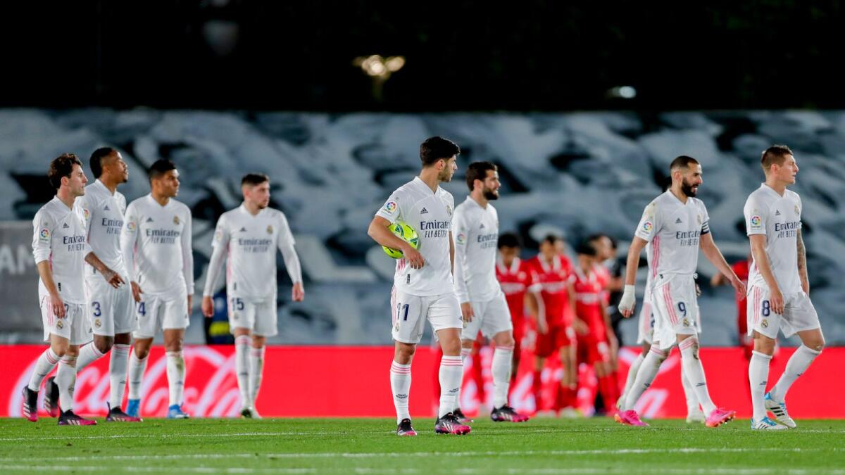 Real Madrid players react after Sevilla scores the second goal during the Spanish La Liga match. — AP