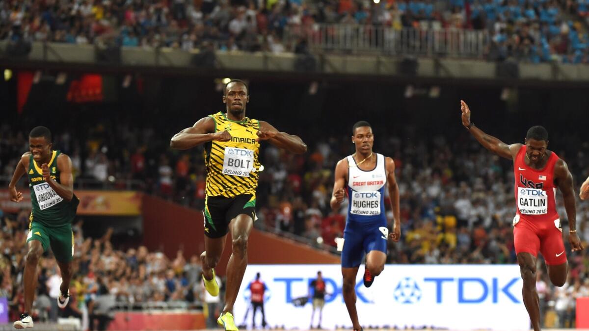 Jamaica's Usain Bolt (2nd-L) wins ahead of South Africa's Anaso Jobodwana (L), Britain's Zharnel Hughes and USA's Justin Gatlin (R) in the final of the men's 200 metres athletics event at the 2015 IAAF World Championships at the 'Bird's Nest' National Stadium in Beijing on August 27, 2015.   AFP PHOTO / OLIVIER MORIN