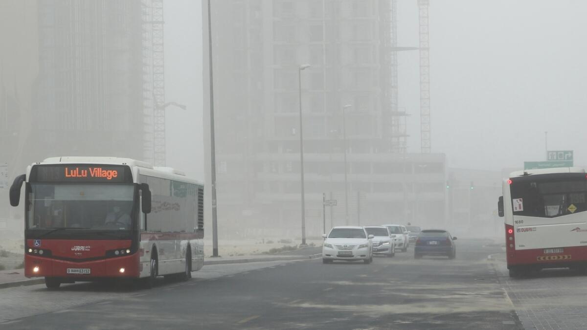 In Dubai, rain of various intensity levels and dust storm struck some areas, prompting authorities to issue road warnings for drivers. (Photo by Juidin Bernarrd/ Khaleej Times)