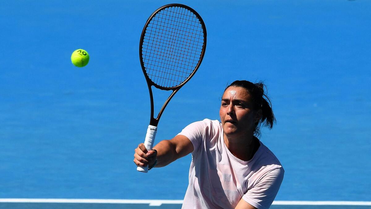 Tunisia's Ons Jabeur hits a return during a practice session ahead of the Australian Open. — AFP