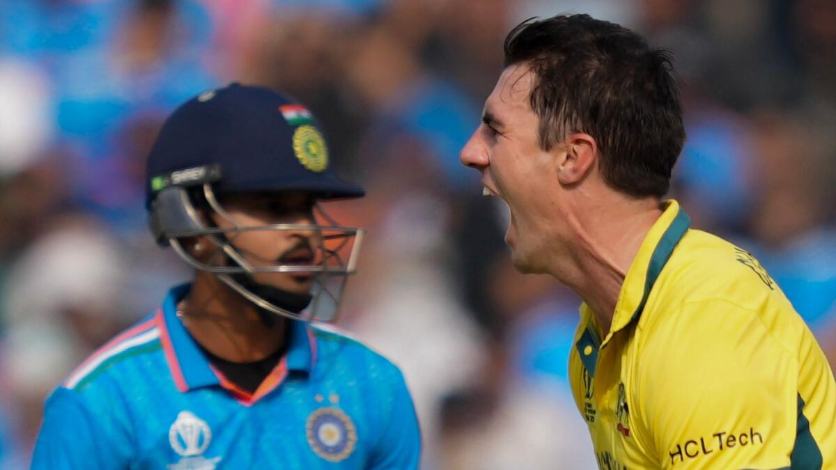 Australia's bowler Pat Cummins celebrates the wicket of Indian batter Shreyas Iyer. Photo: PTI