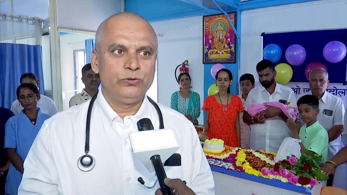 Dr Ganesh Rakh speaks to the media on waiving off hospital charges for the birth of female children born at his hospital and celebrating their birth by cutting a cake, in Pune on Sunday. — ANI