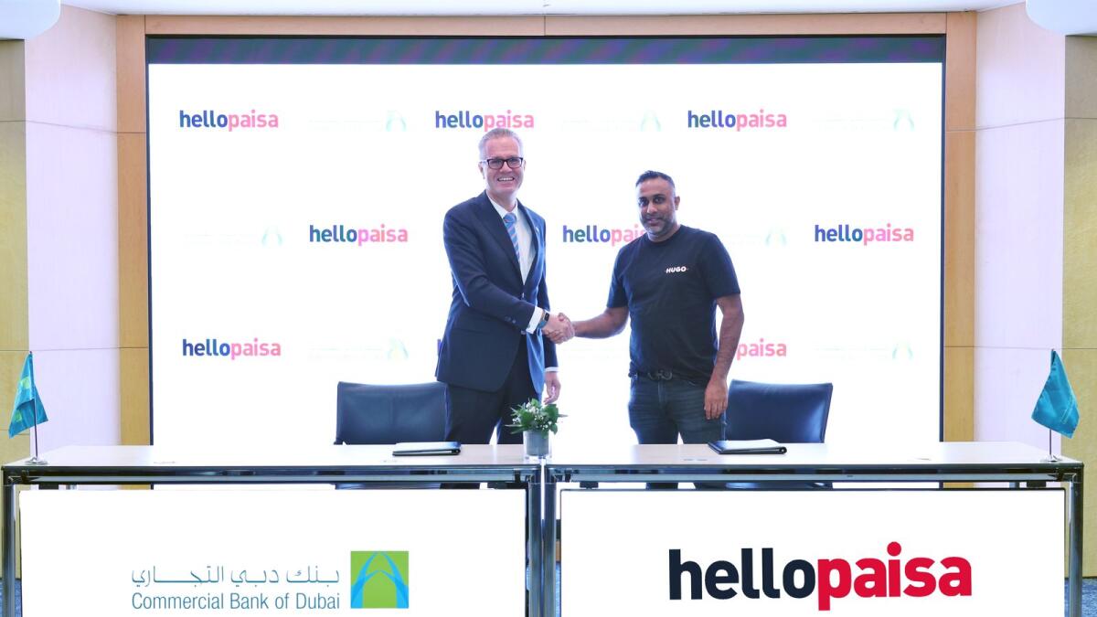 Dr Bernd van Linder, chief executive officer of Commercial Bank of Dubai, and Moosa Manjra, chief executive officer of Hello Group, signed the agreement on belf of their respective organisations. — Supplied photo