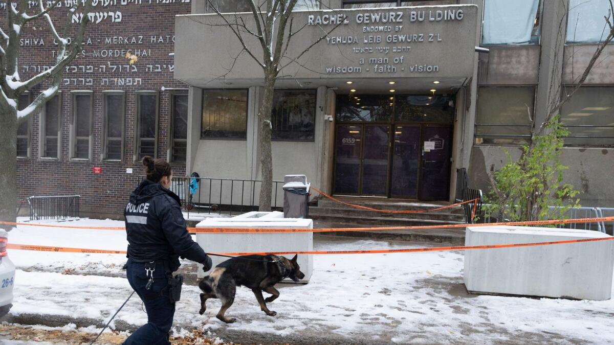 Police search for clues at the Yeshiva Gedolah school after shots were fired at two Jewish schools Thursday, Nov. 9, 2023 in Montreal. AP