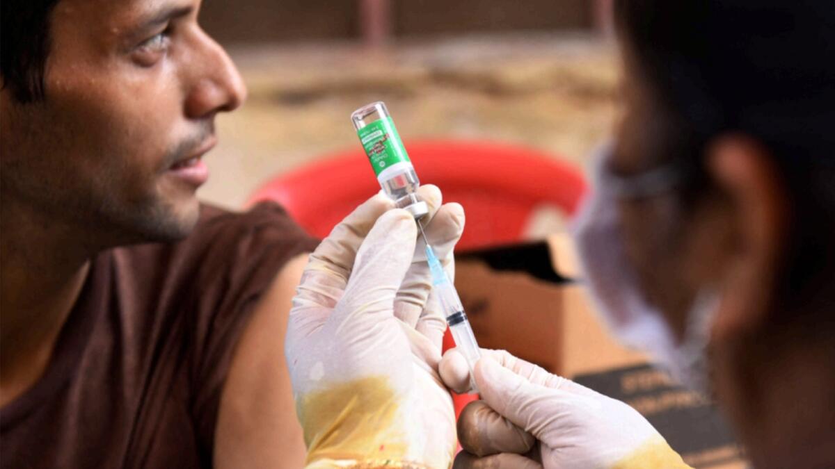 A person receives Covishield vaccine in India. — AFP