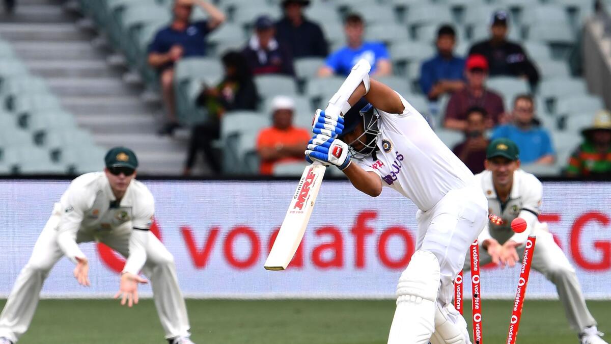 Prithvi Shaw is clean bowled by Mitchell Starc on the first day of the opening Test. — AFP