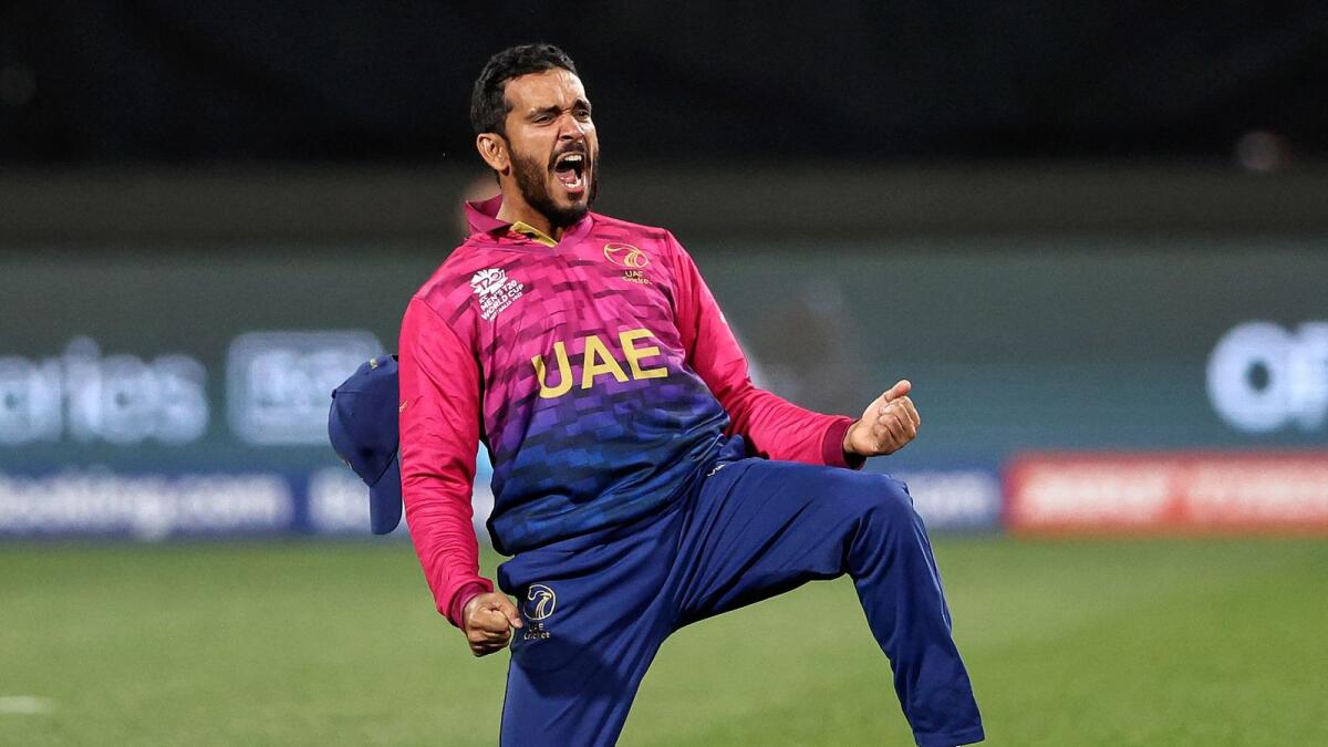 UAE captain CP Rizwan celebrates a catch to dismiss the Netherlands' Bas de Leede during the T20 World Cup match. (AFP)