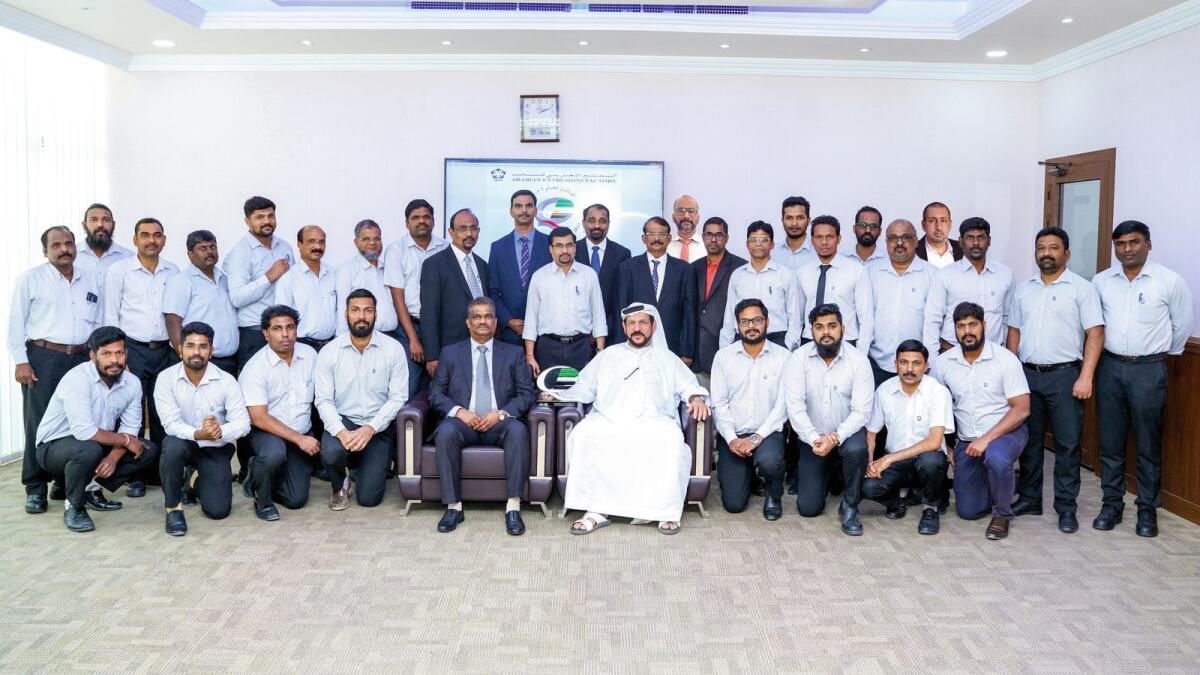 Ibrahim Saeed Al Ghas and Vasanth Shetty with team at Arabian Extrusions Factory.