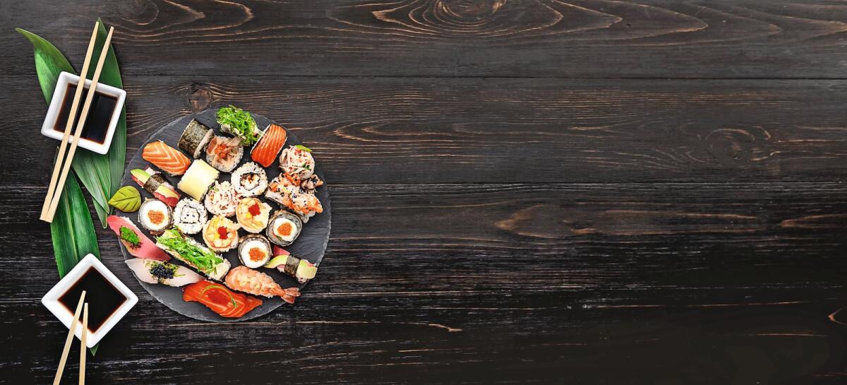 Sushi on a black wooden surface