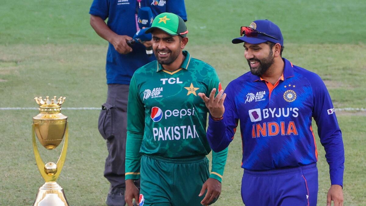 India's captain Rohit Sharma (right) and Pakistan captain Babar Azam arrive for the toss before start of the Asia Cup match. (AFP)