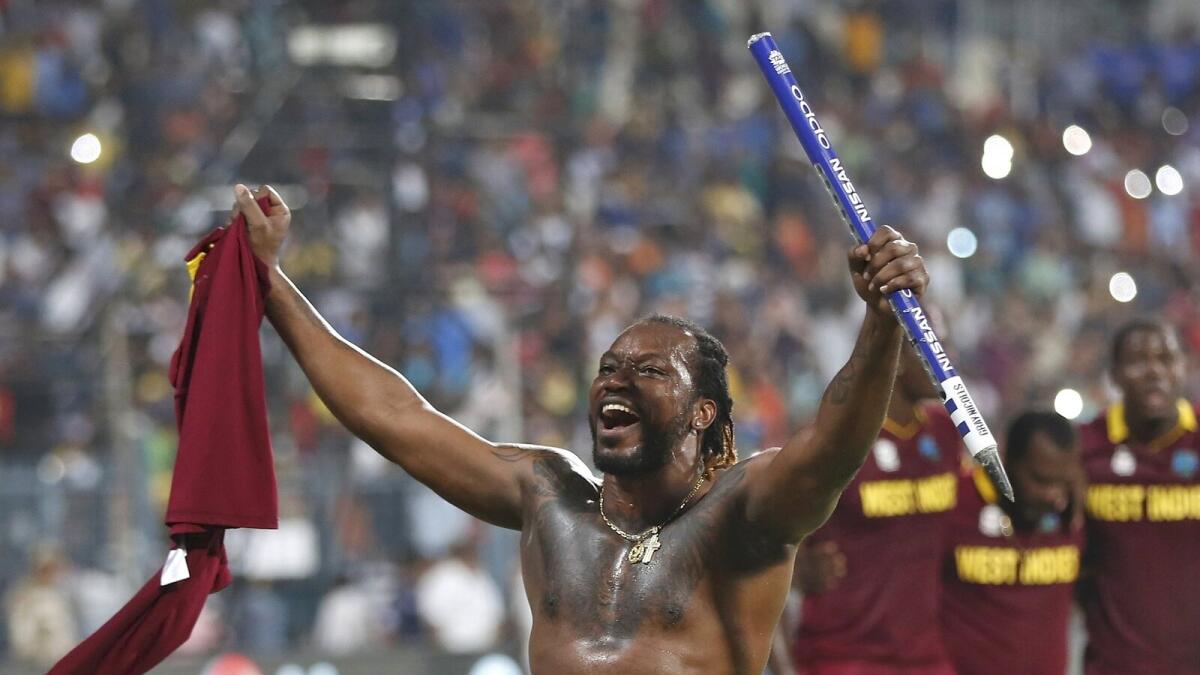 West Indies Chris Gayle celebrates after they won the final.