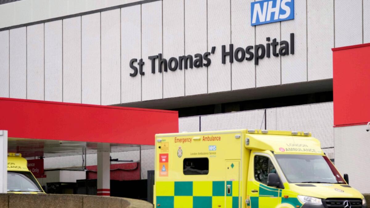 An ambulance waits outside St Thomas' hospital in London. — AP