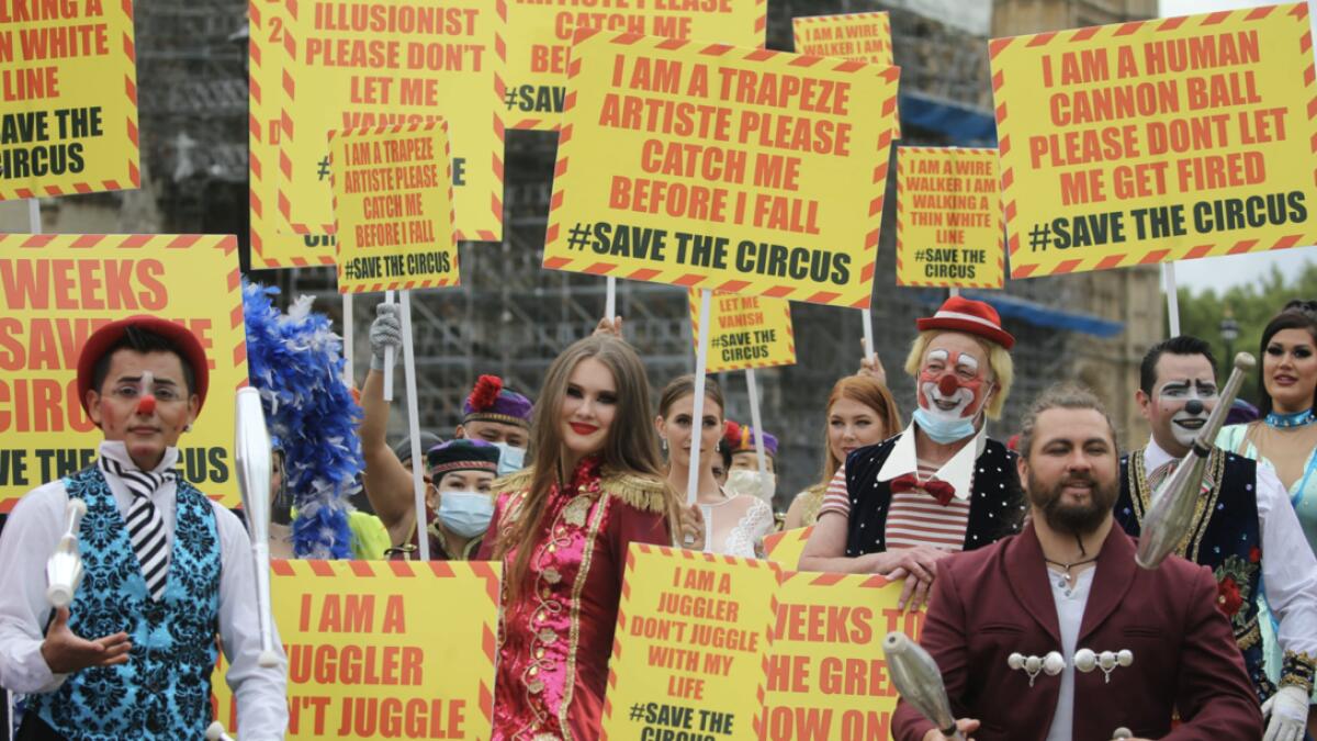 Circus performers of the Association of Circus Proprietors gather outside Downing Street in central London, as they deliver a letter for the Prime Minister calling for the right to reopen for their summer peak season. Photo: AFP