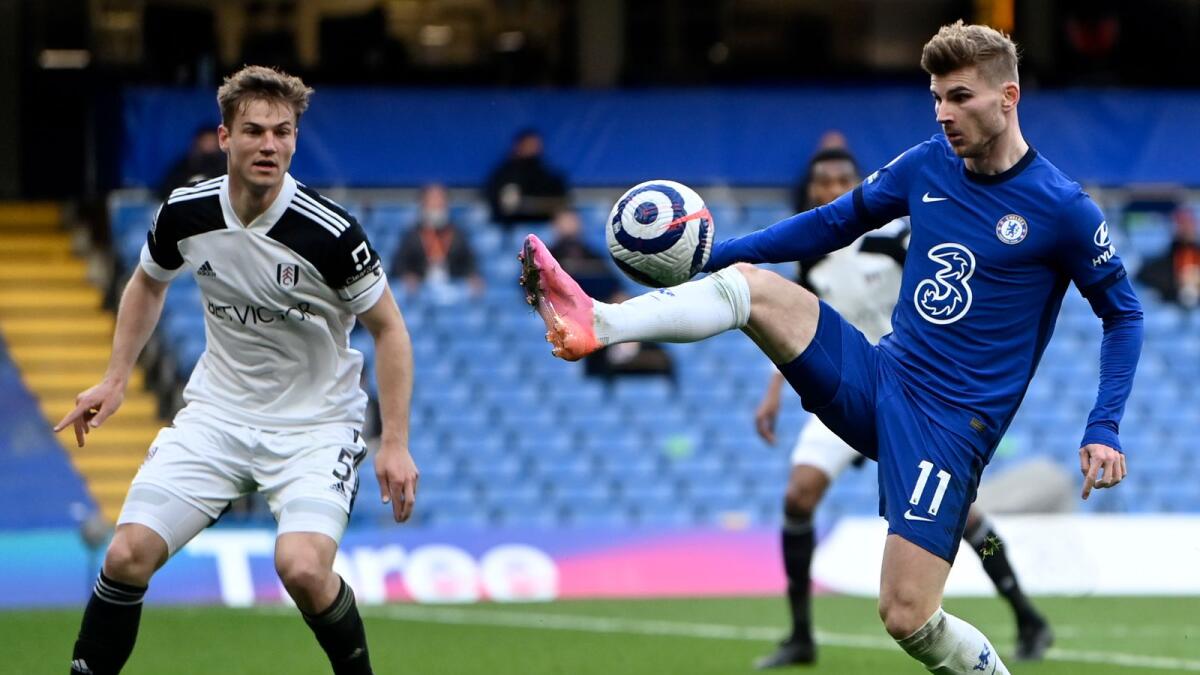 Chelsea's Timo Werner (right) duels for the ball with Fulham's Joachim Andersen. — AP