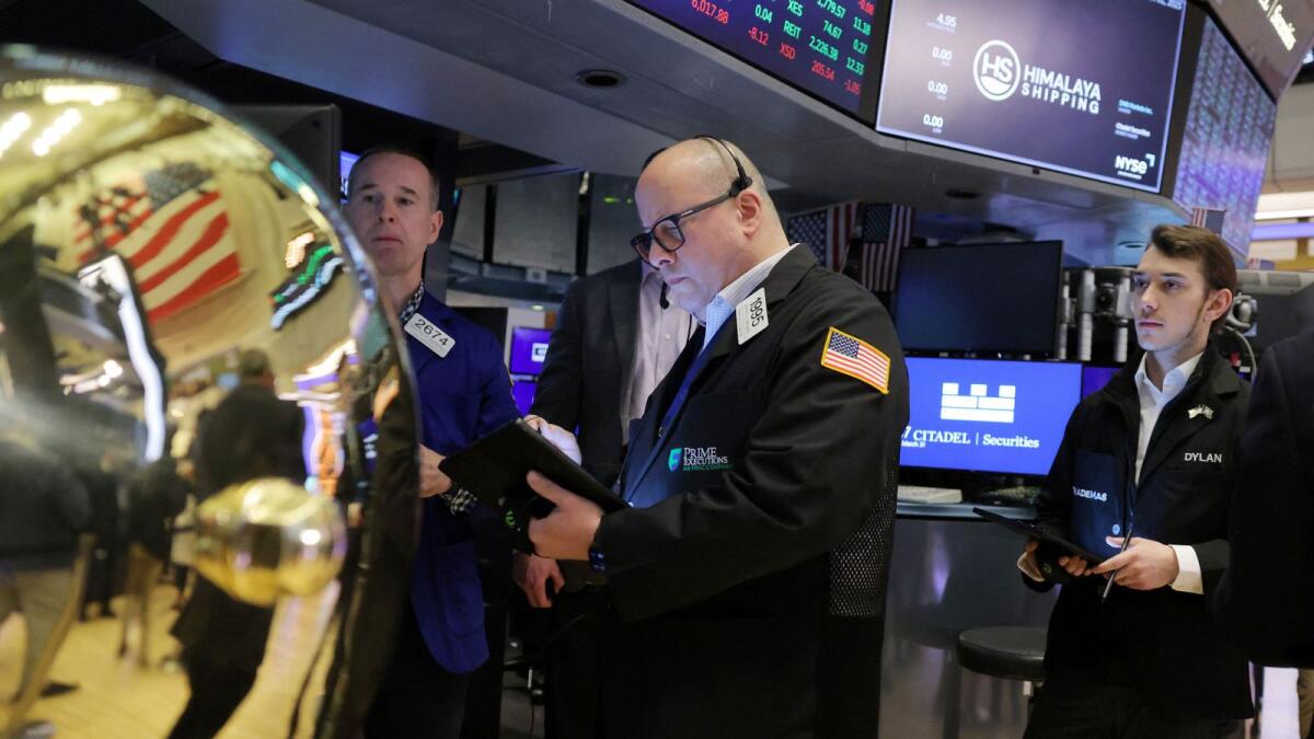 Traders at the New York Stock Exchange. - Reuters